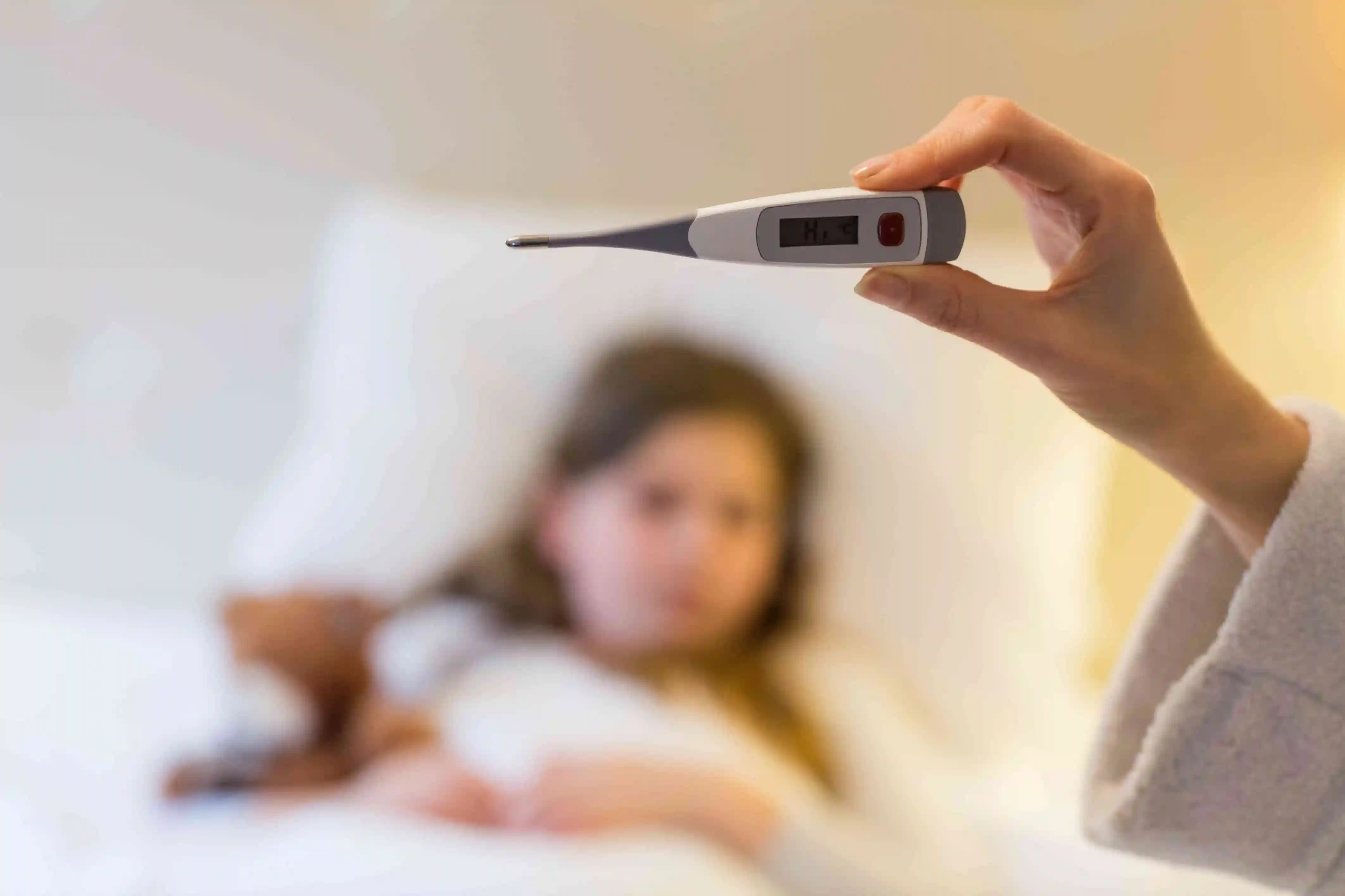 Child with fever, cough and cold — common childhood illness symptoms